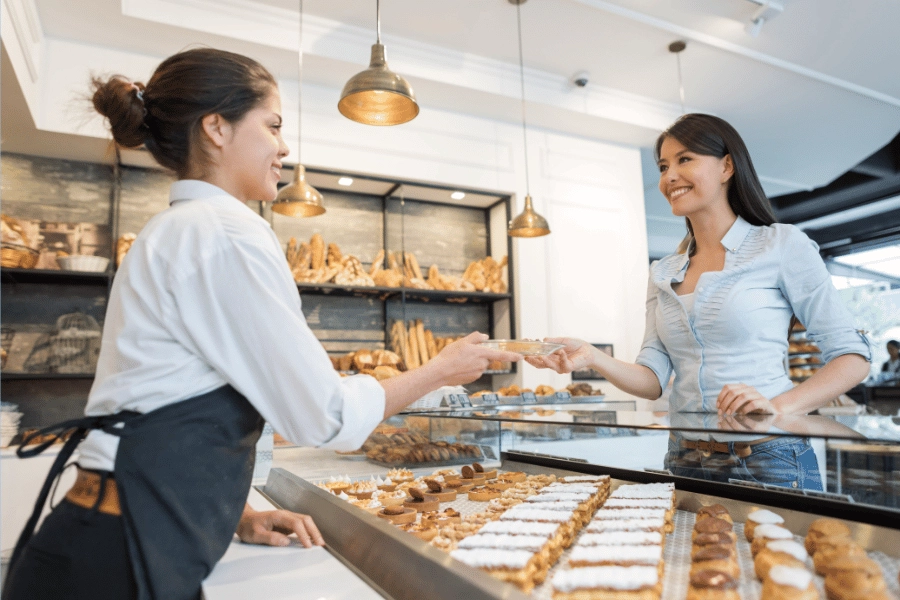 patron buying baked goods at a bakery 